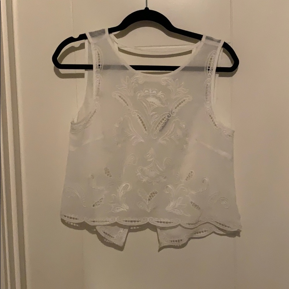 White cropped tank with floral cutouts/details